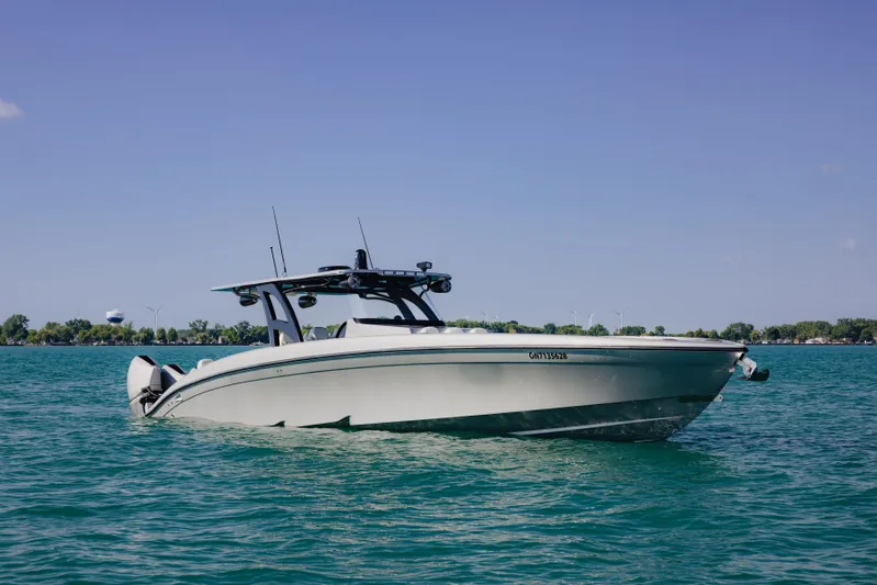  Yacht Photos Pics 2021 Midnight Express 43 Open boat on clear blue water under a sunny sky.