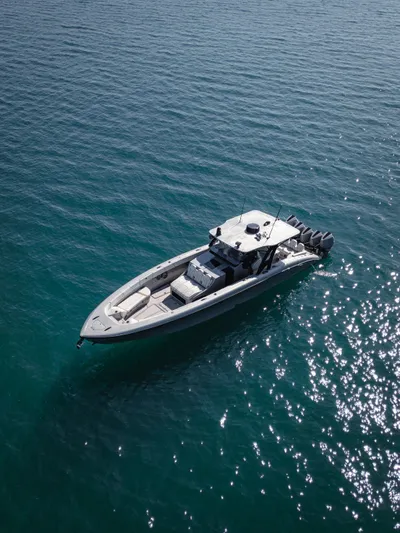  Yacht Photos Pics 2021 Midnight Express 43 Open boat on calm blue water, aerial view.