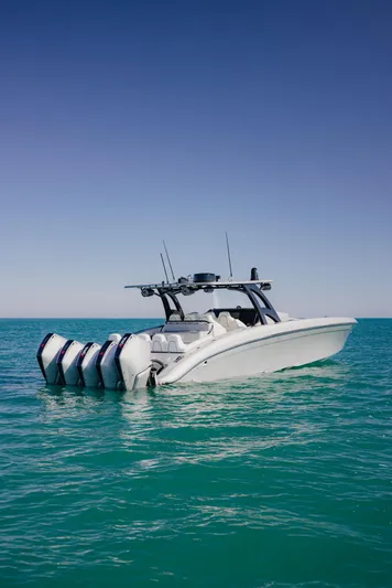  Yacht Photos Pics 2021 Midnight Express 43 Open boat with multiple engines on turquoise water.