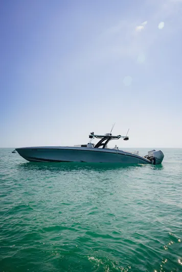  Yacht Photos Pics 2021 Midnight Express 43 Open boat on calm ocean under clear blue sky.