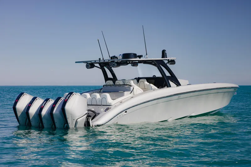  Yacht Photos Pics 2021 Midnight Express 43 Open boat with multiple engines on clear blue water.