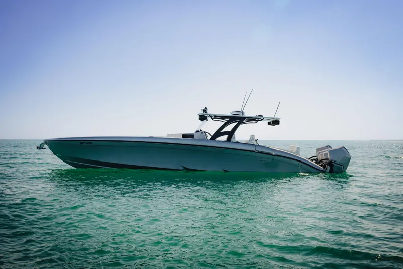  Yacht Photos Pics 2021 Midnight Express 43 Open boat on calm ocean waters under clear sky.