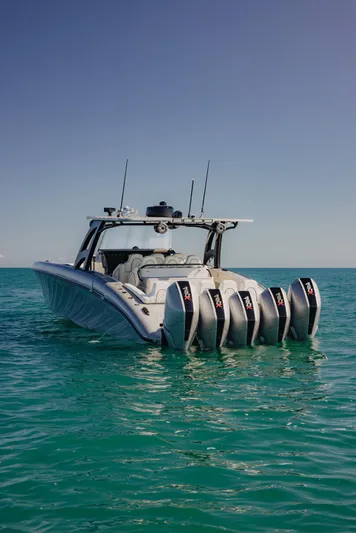  Yacht Photos Pics 2021 Midnight Express 43 Open boat with multiple engines on turquoise water.