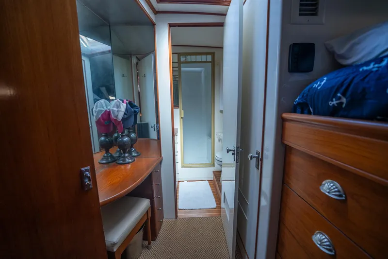 Ta-boo Yacht Photos Pics Interior of 1970 Rybovich 54 yacht with wooden furnishings and cozy cabin space.