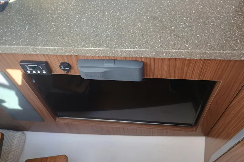 350-004 Brokerage Joe Yacht Photos Pics 2019 Four Winns H350 OB interior with wood paneling and Fusion audio system.