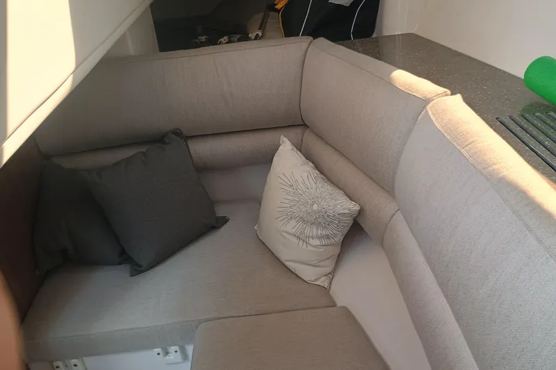 350-004 Brokerage Joe Yacht Photos Pics Interior seating area of 2019 Four Winns H350 OB boat with cushions.