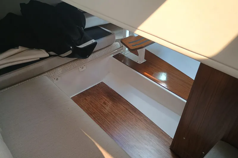 350-004 Brokerage Joe Yacht Photos Pics Interior of 2019 Four Winns H350 OB boat with wooden flooring and seating.