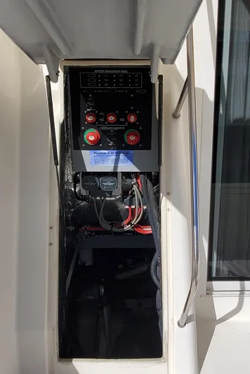 Chelarious Yacht Photos Pics Electrical panel of a 2005 Meridian 411 Sedan boat, featuring control switches and wiring.