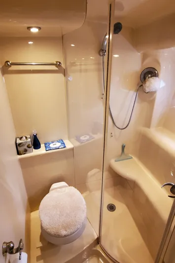 Chelarious Yacht Photos Pics Luxurious bathroom in 2005 Meridian 411 Sedan yacht with shower and toilet.