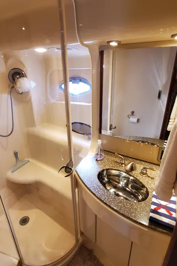 Chelarious Yacht Photos Pics Luxurious bathroom in 2005 Meridian 411 Sedan yacht with modern fixtures and elegant design.