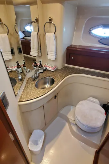 Chelarious Yacht Photos Pics Luxurious bathroom in 2005 Meridian 411 Sedan yacht with modern amenities.