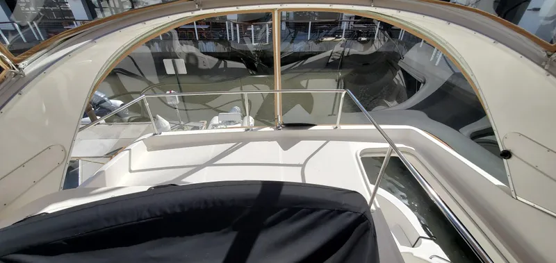 Chelarious Yacht Photos Pics 2005 Meridian 411 Sedan yacht interior with sleek design and spacious seating area.