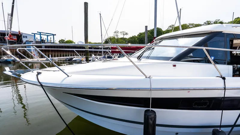  Yacht Photos Pics 2018 Jeanneau NC11 yacht docked at marina, side view.