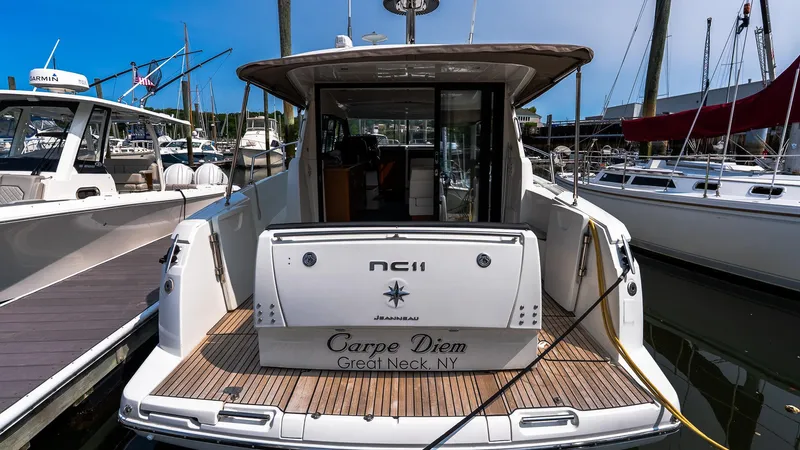  Yacht Photos Pics 2018 Jeanneau NC11 yacht docked, rear view, named "Carpe Diem," Great Neck, NY.