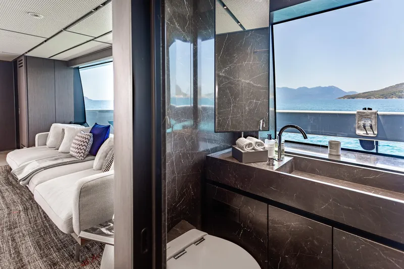 Just Marie 3 Yacht Photos Pics Luxurious interior of 2021 Sanlorenzo SX112 yacht with elegant bathroom and scenic ocean view.