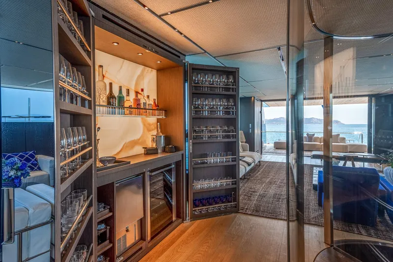 Just Marie 3 Yacht Photos Pics Luxurious interior of 2021 Sanlorenzo SX112 yacht with elegant bar and ocean view.