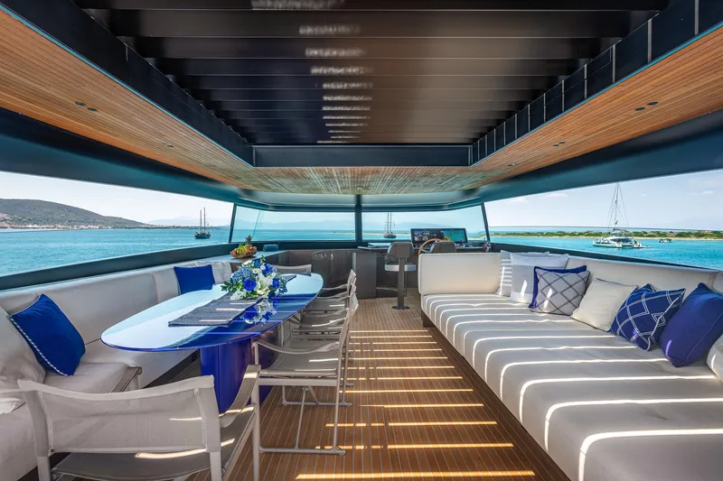 Just Marie 3 Yacht Photos Pics Luxurious interior of 2021 Sanlorenzo SX112 yacht with elegant seating and ocean view.