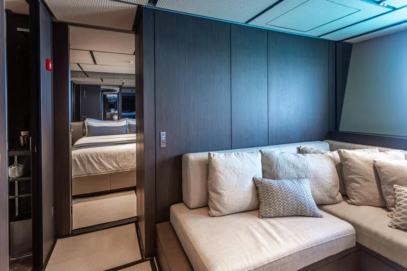 Just Marie 3 Yacht Photos Pics Luxurious interior of 2021 Sanlorenzo SX112 yacht with cozy seating and elegant bedroom.