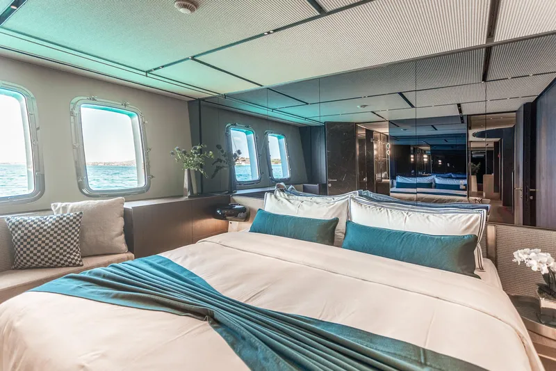 Just Marie 3 Yacht Photos Pics Luxurious bedroom interior of 2021 Sanlorenzo SX112 yacht with ocean view windows.