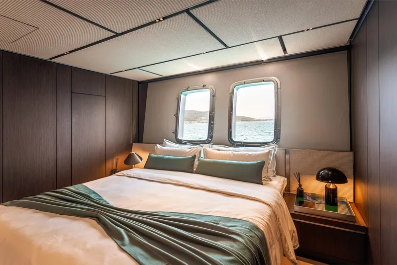 Just Marie 3 Yacht Photos Pics Luxurious Sanlorenzo SX112 2021 yacht bedroom with ocean view and elegant decor.