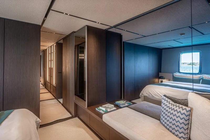 Just Marie 3 Yacht Photos Pics Luxurious Sanlorenzo SX112 yacht interior, featuring modern bedroom design with ocean view window.
