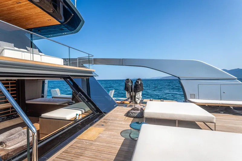 Just Marie 3 Yacht Photos Pics Luxurious 2021 Sanlorenzo SX112 yacht deck with sun loungers and ocean view.