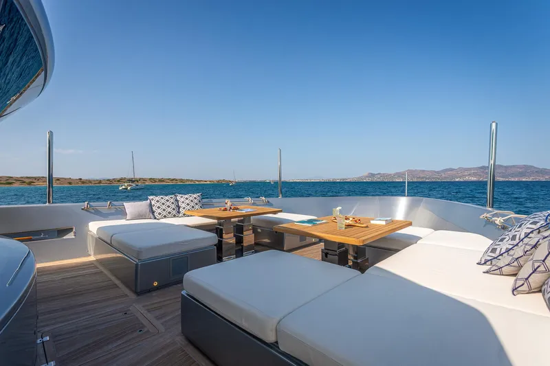 Just Marie 3 Yacht Photos Pics Luxurious Sanlorenzo SX112 yacht deck with seating, tables, and ocean view, 2021 model.