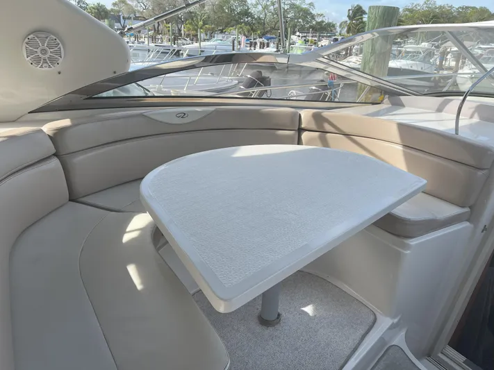  Yacht Photos Pics Interior of 2000 Regal Commodore 4160 yacht with beige seating and table.