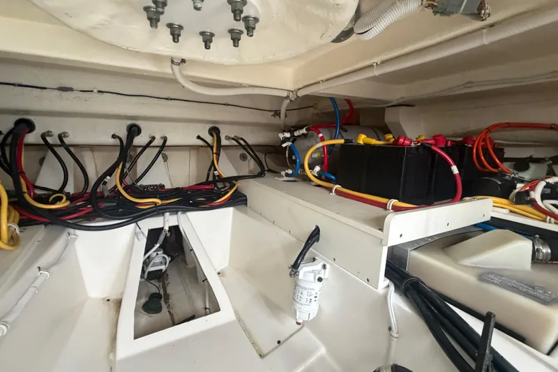  Yacht Photos Pics Engine compartment of 2021 Tiara Yachts 43 LE, showcasing wiring and battery setup.