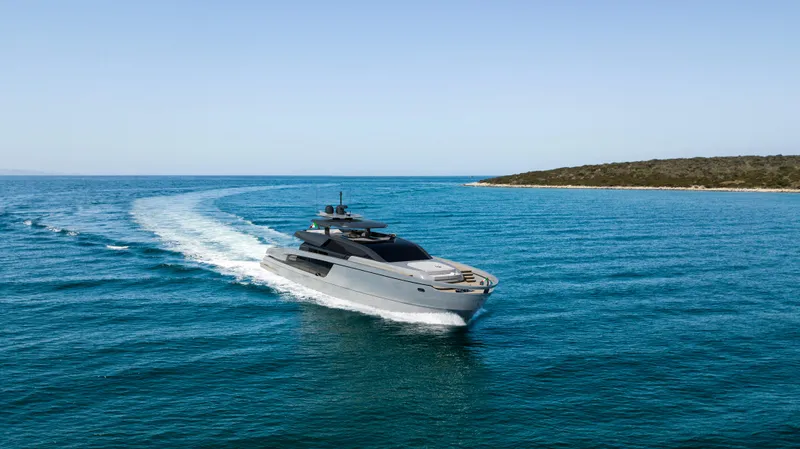 X98 Rph Yacht Photos Pics Luxury yacht Extra X98 RPH 2026 cruising in clear blue waters near a scenic coastline.