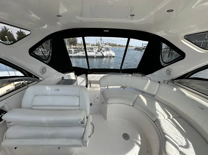 Sharon Ann Yacht Photos Pics 2007 Regal Commodore 3760 IB yacht interior with white seating and panoramic windows.