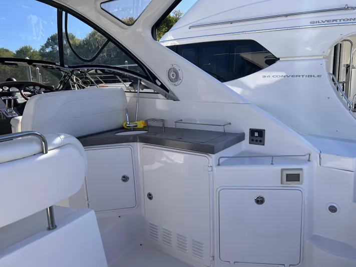 Sharon Ann Yacht Photos Pics 2007 Regal Commodore 3760 IB yacht interior with sleek white cabinetry and seating.