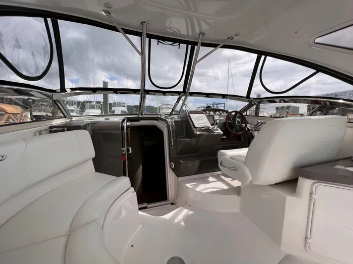 Sharon Ann Yacht Photos Pics 2007 Regal Commodore 3760 IB boat interior with white seating and modern dashboard.