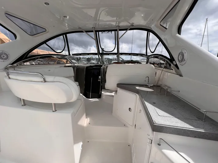 Sharon Ann Yacht Photos Pics 2007 Regal Commodore 3760 IB yacht interior with white seating and sleek design.