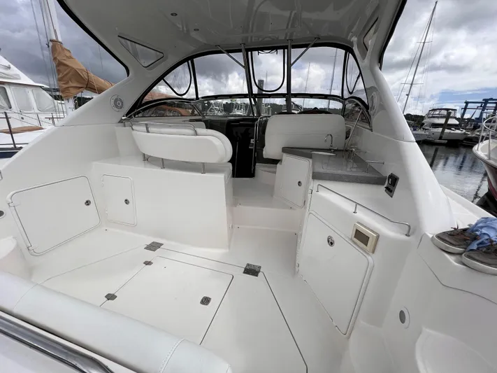 Sharon Ann Yacht Photos Pics 2007 Regal Commodore 3760 IB boat interior with white seating and storage compartments.