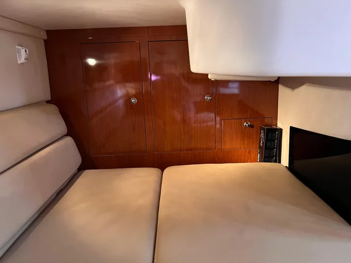 Sharon Ann Yacht Photos Pics Interior cabin of 2007 Regal Commodore 3760 IB with beige seating and wooden cabinetry.