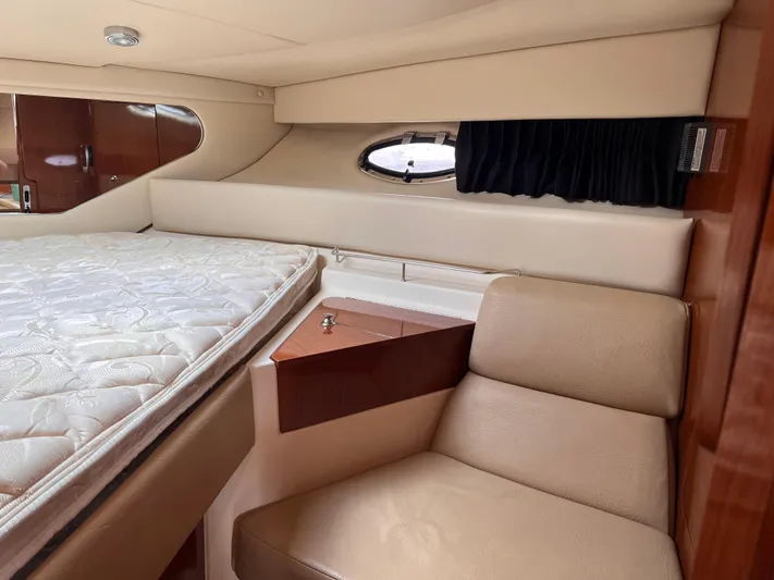 Sharon Ann Yacht Photos Pics 2007 Regal Commodore 3760 IB cabin interior with bed and seating area.