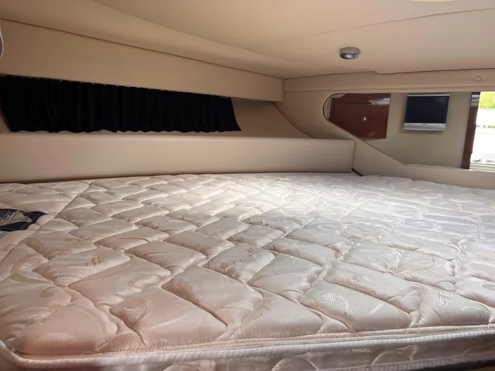 Sharon Ann Yacht Photos Pics 2007 Regal Commodore 3760 IB cabin with a comfortable mattress and modern interior design.