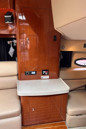 Sharon Ann Yacht Photos Pics 2007 Regal Commodore 3760 IB cabin interior with wood paneling and seating.