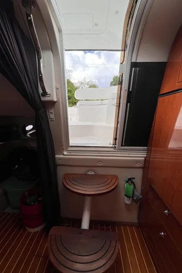 Sharon Ann Yacht Photos Pics Interior view of 2007 Regal Commodore 3760 IB yacht with wooden steps and window.