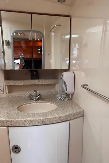 Sharon Ann Yacht Photos Pics 2007 Regal Commodore 3760 IB yacht bathroom with sink, mirror, and soap dispenser.
