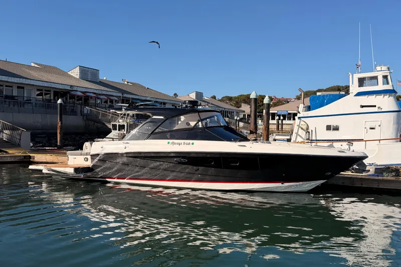  Yacht Photos Pics 2021 Sea Ray SLX 400 docked at marina, clear sky, calm water.