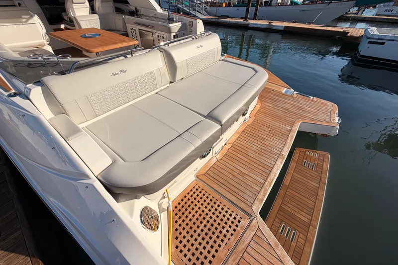  Yacht Photos Pics 2021 Sea Ray SLX 400 boat with spacious deck and luxurious seating at marina.