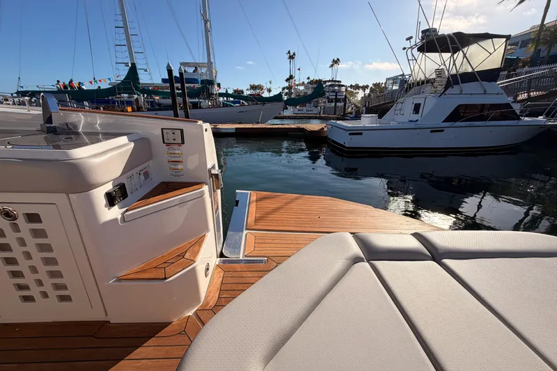  Yacht Photos Pics 2021 Sea Ray SLX 400 yacht interior with wooden deck, docked at marina.