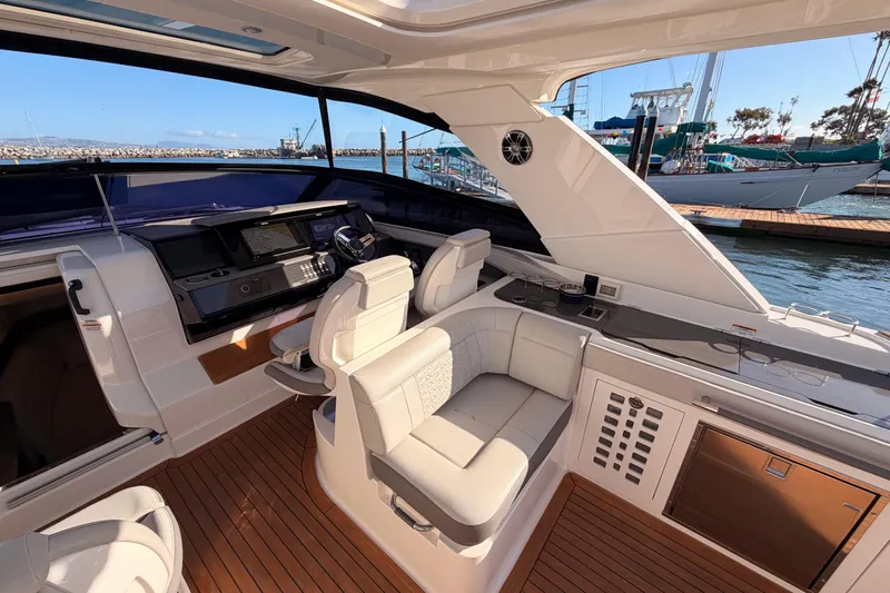  Yacht Photos Pics Luxurious 2021 Sea Ray SLX 400 yacht interior with plush seating and modern helm.
