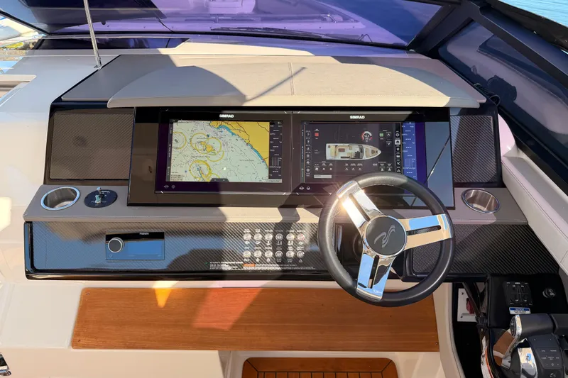  Yacht Photos Pics 2021 Sea Ray SLX 400 helm with advanced navigation system and sleek steering wheel.