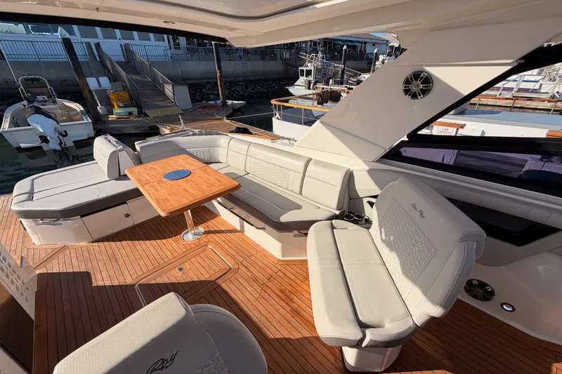  Yacht Photos Pics Luxurious 2021 Sea Ray SLX 400 yacht interior with elegant seating and wooden deck.
