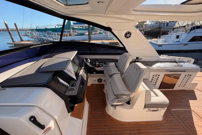  Yacht Photos Pics 2021 Sea Ray SLX 400 yacht cockpit with luxurious seating and modern controls.