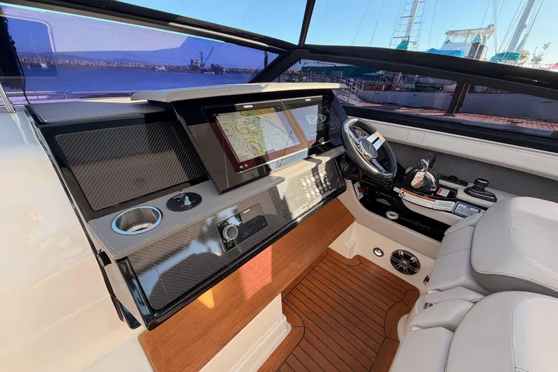  Yacht Photos Pics 2021 Sea Ray SLX 400 helm with modern navigation system and luxurious seating.