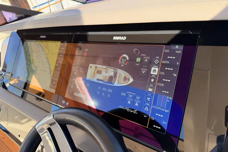  Yacht Photos Pics Dashboard of a 2021 Sea Ray SLX 400 boat with Simrad navigation display.